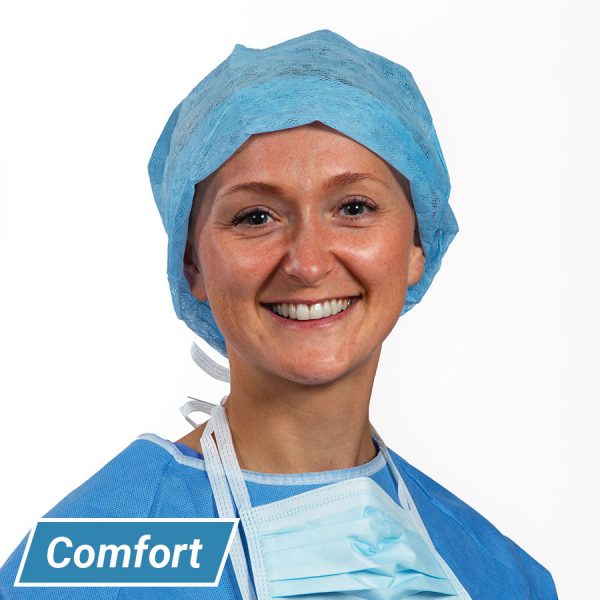Surgeon wearing comfort operating cap with extra length and elasticated back