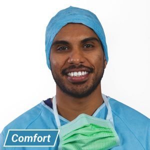 Surgeon wearing comfort operating cap with extra length and rear head ties