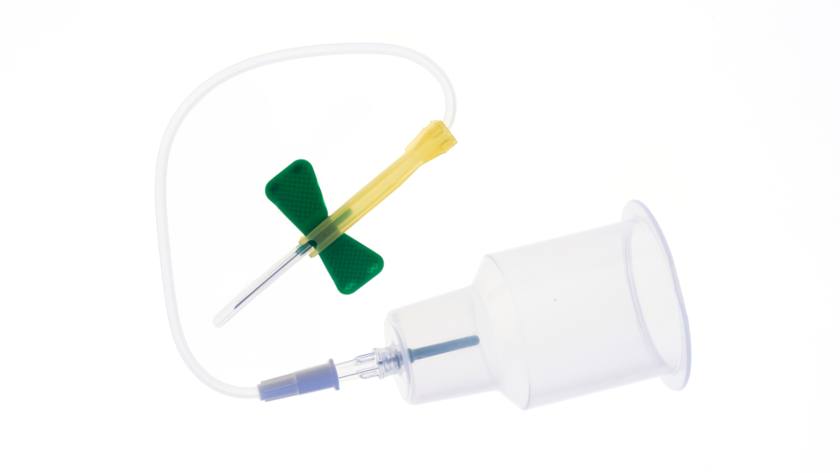 Winged blood collection set with luer adaptor and holder